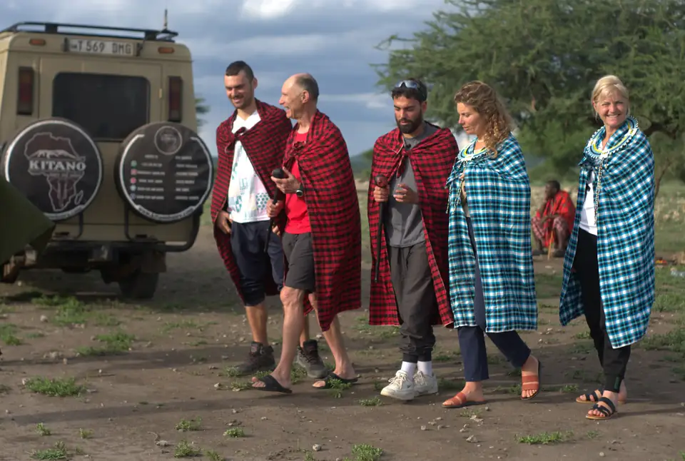 Travelers enjoying an authentic local Tanzania cultural experience